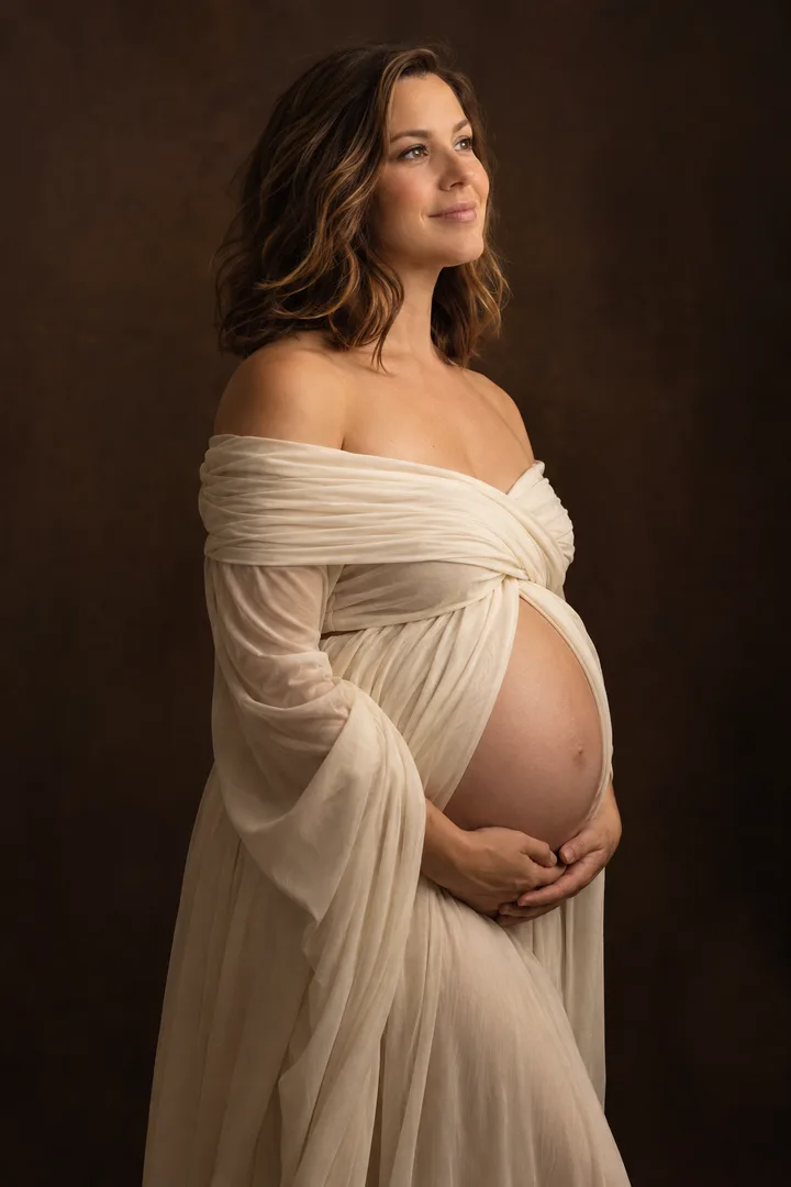 AI maternity portrait example with soft ivory draping